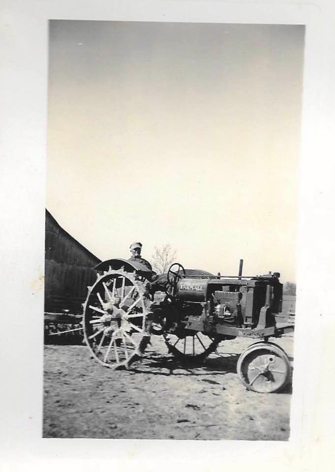 Elmer Dasch on his Farmall tractor