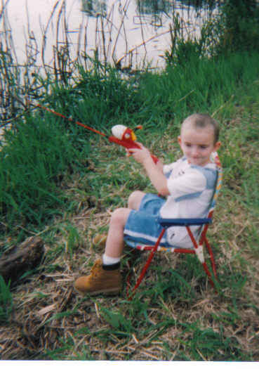 Timmy, age 3, fishing at our lake front