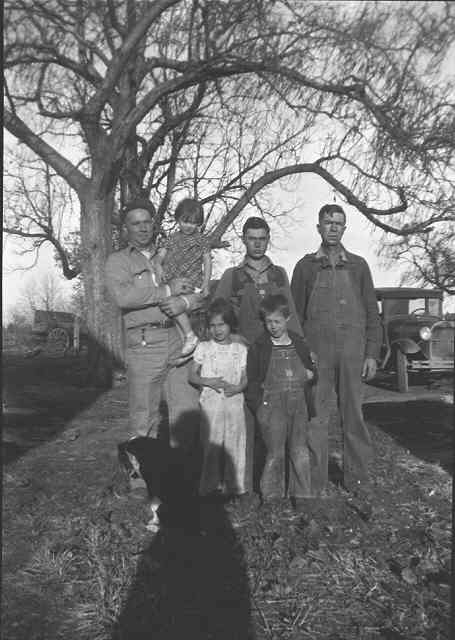 Uncle Joe Wilson, holding Nella, Adrian, Dad in back row, Barb and Glenn in front